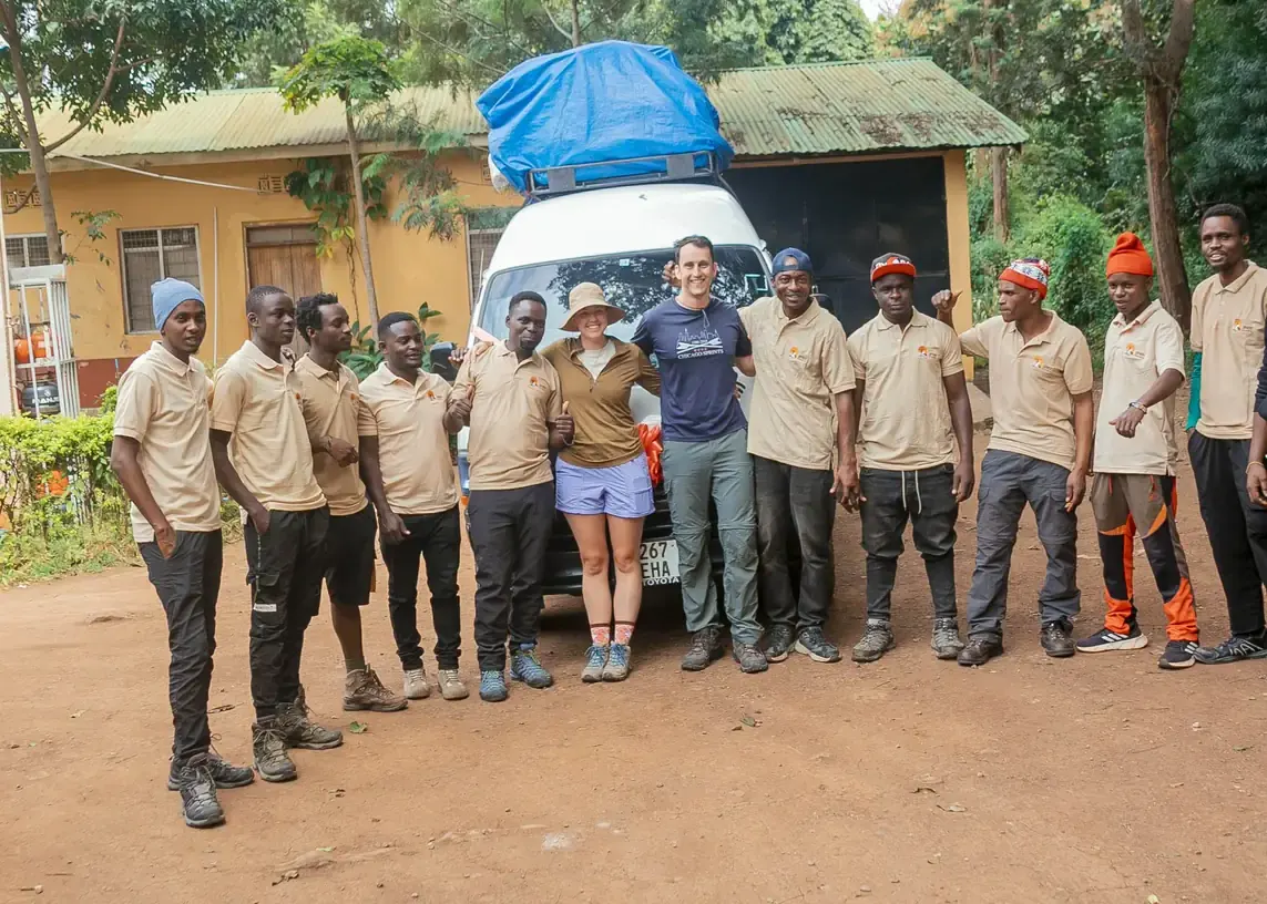 A honeymoon couple with their guides and porters in Jaynevy Tours uniform, ready to leave for the mountain