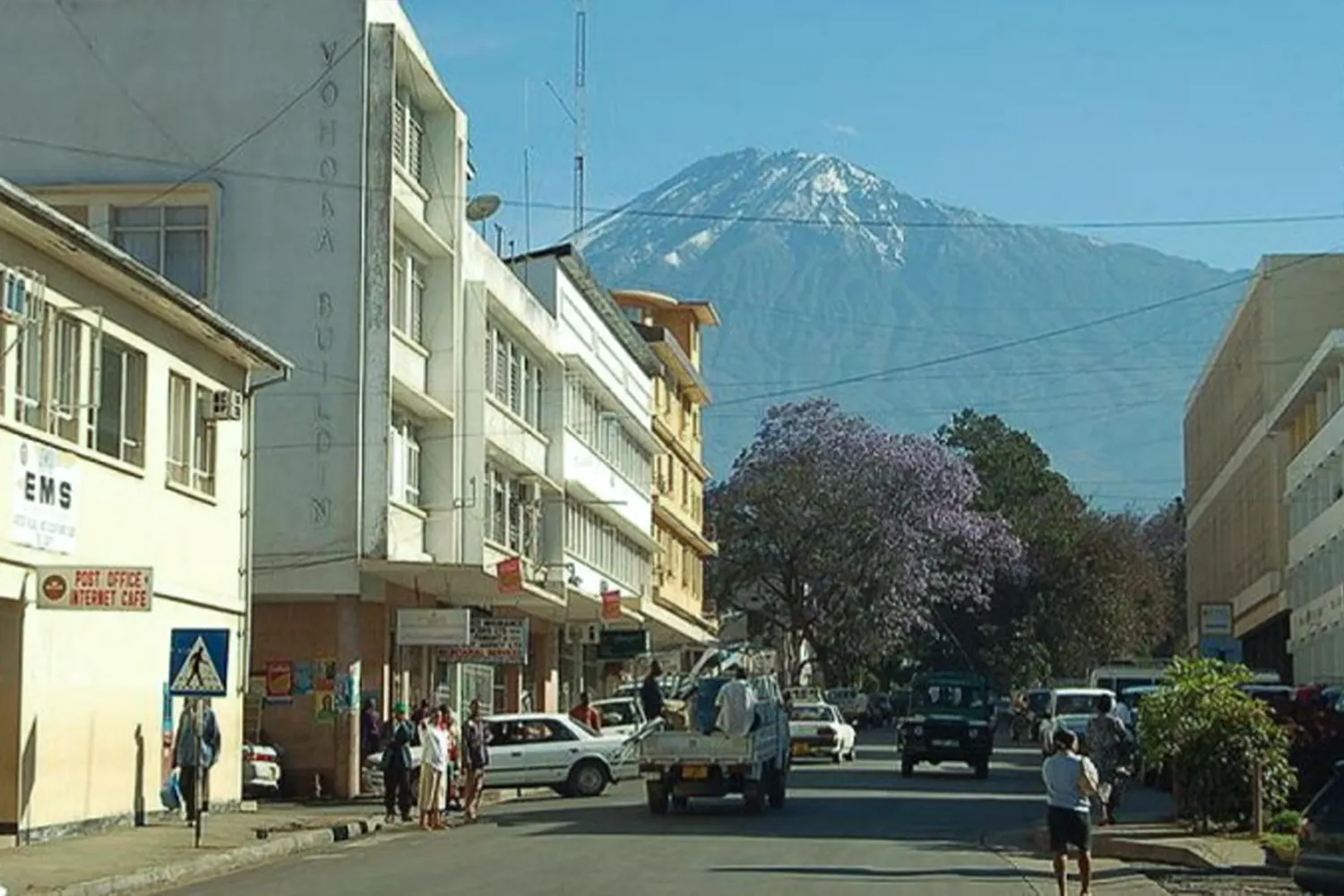 A street in Arusha's city center with Mount Meru rising behind the buildings